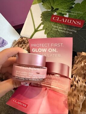 Clarins Skincare Box with Red Logo and Green Leaf Artwork